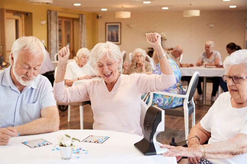 Senior woman winning at the game of bingo concept image for bingo prize ideas for seniors